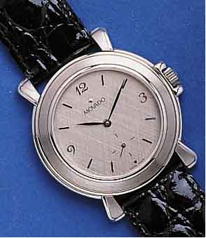 MOVADOMOVADO HERRENARMBANDUHR, SCHWEIZ UM 1995, UNGETR. LAGERW., LEDERB., ORIG.-ETUI, EDELST. POL., TEILW. SAT., STILTYP. 40ER JAHRE, FLACHE ...