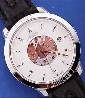 MIDO HERRENARMBANDUHR JUBILEE 1918 AUTOMATIK, BASISKAL. VON ETA, EDELST. POL., SAPHIR- FLACHGL., ZEIGERWERK SICHTB., EMAILFARB. ...