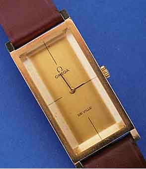 OMEGA HERRENARMBANDUHR DE VILLE, SCHWEIZ UM 1974, AUFWEND. RECT.-FORM, HARTVERG. (20 MI- CRON AUFL.), EDELST.-BODEN GEDR., MAßE CA. 45 X 21 MM, ...
