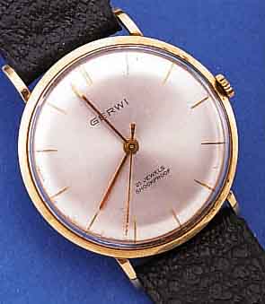 GERWI HERRENARMBANDUHR, DEUTSCHLAND UM 1965,GG 585/000, BODEN GEDR., BLATT VERS., 21 ST., HANDAUFZUGKAL. PUW 260, RINGUNR., FLACHSPIR., STOßGES., ...