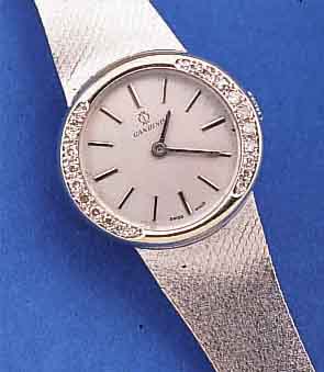 CANDINO DAMENGOLDBANDUHR, SCHWEIZ/DEUTSCH- LAND UM 1974, WG 585/000 RHOD. INCL. MILANAI- SEBAND, LüNETTE SEITL. M. DIAMANTBES., BODEN GEDR., ...