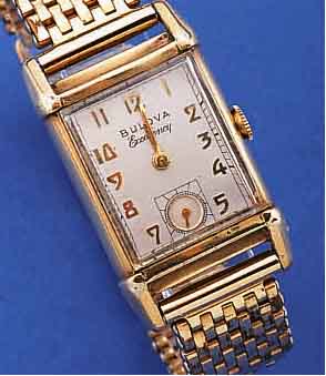 BULOVA HERRENARMBANDUHR EXCELLENCY, USA UM 1949, ROSE-G.-FILLED INCL. BAND ZEITIDENT., RECT.-FORM BER., BODEN GEDR., KL. SEK. VERT., FORMANKERW., ...