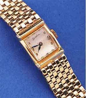 SANDOZ DAMENGOLDBANDUHR, SCHWEIZ UM 1948, GG 585/000 INCL. GG-BAND, BODEN GEDR., VERS. BLATT, GEBL. STAHLZEIGER, FORMANKERW., 17 ST., ...