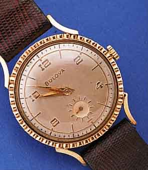 BULOVA HERRENARMBANDUHR, USA UM 1950, GG- FILLED, LüNETTE SCHMUCKGEPR., BODEN GEDR., ORIG. VERS. BLATT ALTERSBED. FL., KL. SEK. VERT., ...