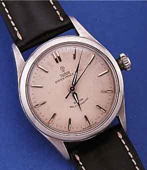 TUDOR OYSTER PRINCE 34 HERRENARMBANDUHR, SCHWEIZ UM 1950, EDELST., BODEN U. KRONE GE- SCHR., ORIG.-BLATT FL., AUTOMATIK ENTNOMMEN, UMGEB. AUF ...