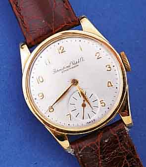 IWC HERRENARMBANDUHR, SCHWEIZ UM 1938, NEU- TR. GG 585/000-GEH., BODEN U. GLASR. GEDR., BLATT REST., 15 ST., HANDAUFZUGKAL. 83, GEPR. CHATONS, ...