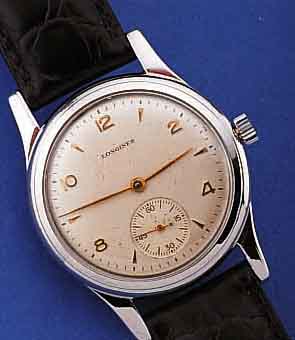 LONGINES HERRENARMBANDUHR, SCHWEIZ UM 1948, EDELST., BODEN GEDR., VERS. BLATT L. ALTERS- BED. FL., 16 ST., RUNDANKERW., KAL. 27M, ...