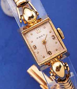 EBEL DAMENGOLDBANDUHR, SCHWEIZ UM 1948, GG 750/000 INCL. GG-SCHLANGENGLIEDERB., SICHERHEITSKETTCHEN, BODEN GEDR., VERS. BLATT,ALTERSBED. ...