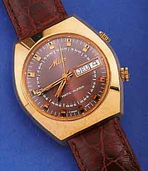 MIDO ARMBANDAUTOMATIKWECKER, SCHWEIZ UM 1975, METALL HARTVERG., EDELST.-BODEN GESCHR.,LEDERB. NEU, TAG U. DATUM, ZENTRALSEK., WERK VERG., ...