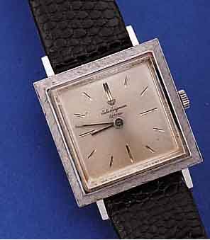 JULES JÜRGENSEN HERRENARMBANDUHR, SCHWEIZ/ USA UM 1965, GG 585/000, CARREE-GEH., LüNETTE GEST., KONKAVGL., BODEN GEDR., VERS. BLATT, 17 ST., ...