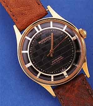 RODANIA HERRENARMBANDUHR, SOGEN. COCKTAILS- WATCH, SCHWEIZ UM 1954, FRüHE BEIDS. VERGL., METALL HARTVERG., STD.-ZIFFERBL.-BER. ROT UNTERL., 17 ...