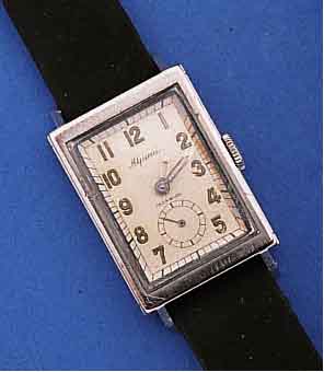 ALPINA HERRENARMBANDUHR, IM FRÜHEN, WASSER- D. RECT.-GEH., EDELST., AUFWEND. VERARB., BEIDE HALBSCH. WERDEN SEITL. DURCH SCHWALBEN- SCHWANZFÖRM. ...