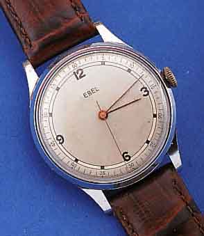 EBEL HERRENARMBANDUHR, SCHWEIZ UM 1945, METALL VERCHR., EDELST.-BODEN U. GLASR. GEDR.,AUßER LEDERB. U. KRONE ORIG.-ZUST., D. CA. 35 MM, ...