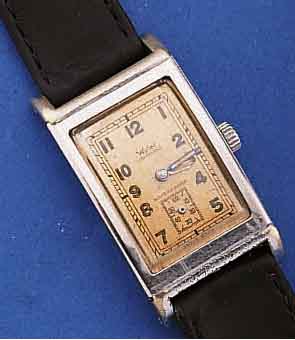 KONVOLUT: 2 WYLER HERRENARMBANDUHREN, SCHWEIZ UM 1939, BEIDE EDELST., RECT.-FORM, 1X BODEN GEDR., 1X WASSERGESCH. AUSF. M. GET. A-WELLE (HIER ...