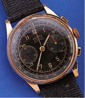 DOGMA ARMBANDCHRONOGRAPH, SCHWEIZ UM 1948, RG 750/000, BER./DELLIG, TEILW. FEIN HAARR., 30-MIN.-STOPPZäHLER, BODEN U. GLASR. GEDR., METALLCUV. ...