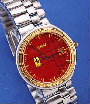 FERRARI HERRENARMBANDUHR, UM 1994, EDELST., ASYMETR. GEH.-FORM U. BAND MATT., BODEN GEDR.,MINERALFLACHGL., KRONE U. LüNETTE HARTVERG., ...