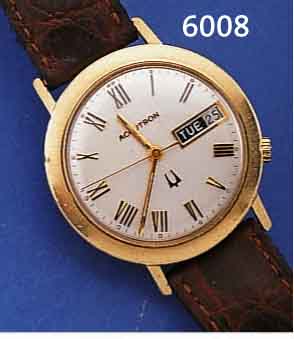 BULOVA ACCUTRON HERRENARMBANDUHR, SCHWEIZ UM 1970, GG-FILLED, BODEN GESCHR., TAG U. DATUM, RELIEF., RöM. STD.-ZEICHEN, NUTZSP., ...