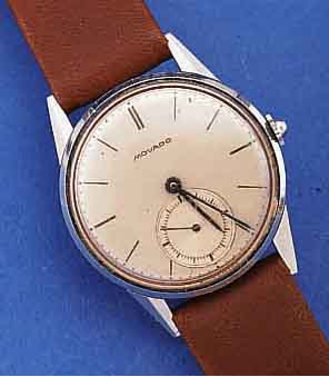 MOVADO HERRENARMBANDUHR, SCHWEIZ UM 1940, EDELST., BODEN U. GLASR. GEDR., VERS. BLATT, ZUM RAND ZU L. FL., GEBL. STAHLZEIGER, 15 ...