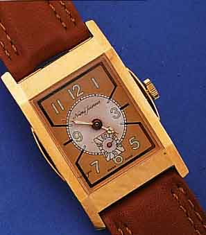 NUMA JEANNIN HERRENARMBANDUHR REPLIKA VON 1938, RECT., HARTVERG., BODEN GEDR., KUPFER-FARB. BLATT, SCHWEIZ UM 1996, RUNDANKERW. VON FHF, 17 ST., ...