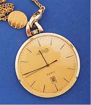 FRACKUHR, SCHWEIZ UM 1985, JUBILÄUMSUHR DER FIRMA RAG, SO SONDERGRAV. AUF BODEN, GG 585/ 000, HIGH-TECH-QUARTZW. M. SEK.-TAKT U. DATUM, ...