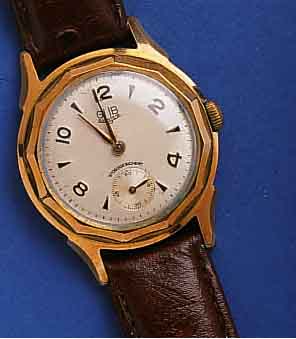 GUB HERRENARMBANDUHR, KAL. 60, DEUTSCHLAND UM 1954, AUFWEND. METALLGEH. HARTVERG., EDEL- ST.-BODEN GESCHR., BEI FERTIGST. WASSERGESCH., AUßER ...
