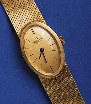 JUNGHJUNGHANS DAMENGOLDBANDUHR, DEUTSCHLAND UM 1970, GG 585/000 INCL. GG-FLECHTB., BODEN GE- DR., FORMANKERW., KAL. 672, 17 ST., HANDAUFZUG ...