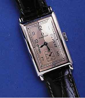 OMEGAOMEGA HERRENARMBANDUHR, SCHWEIZ UM 1940, EDELST., RECT.-FORM, BLATT PERF. REST., BODEN GEDR., TONNENFÖRM. ANKERW., 15 ST., KAL. T17, ...