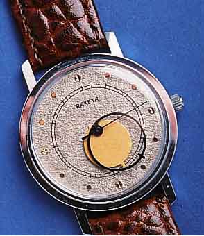RAKETRAKETA HERRENARMBANDUHR, SOWJETUNION UM 1982, METALL VERCHR., EDELST.-BODEN GEDR., MYSTERIEUSE ZEITANZ. ÜBER ZEIGERSCHEIBEN, KAL. 2609, 17 ...