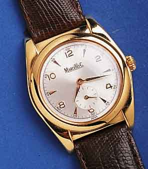 MARCELMARCELLO C HERRENARMBANDUHR, STILTYP. 1950, SCHWEIZ UM 1996, METALL HARTVERG., BEIDS. VERGL., VERS. BLATT, 17 ST., HANDAUFZUGKAL. VON AS ...