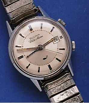 BULOVA BULOVA ARMBANDWECKER WRISTALARM, SCHWEIZ UM 1965, EDELST., BODEN GESCHR., ZUGGLIEDERB. SPÄTER, BEI FERTIGST. WASSERGESCH., WERK VER- G., ...