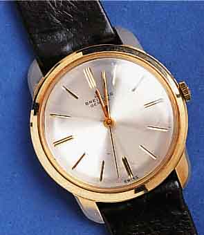 BREITLBREITLING HERRENARMBANDUHR, SCHWEIZ UM 1962, METALL VERG., EDELST.-BODEN GESCHR., VERS. BLATT, ORIG.-LEDERB. U. VERKAUFSLOGO, UNGETR. ...