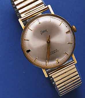 GAMA GAMA HERRENARMBANDUHR, SCHWEIZ/DEUTSCHLAND UM 1960, GG 585/000, EINSCHALENAUSF., FIXO- FLEX-GLIEDERB. SPÄTER, 17 ST., HANDAUFZUGKAL. VON ...