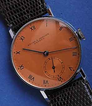 BAUME BAUME & MERCIER HERRENARMBANDUHR, METALLGEH. VERCHR., GEDR. EDELST.-BD. U. GLASRAND, CU- FARB. BLATT, GEBL. STAHLZEIGER, 15 ST., HAND- ...