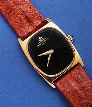 BAUME & MERCIER HERRENARMBANDUHR, GG 750/000 -GEH., TONNENFORM, BODEN GEDR., MINERALFLACH- GL., SAPHIRSCHMUCKKR., WERK VERG., 17 ST., KAL. 1050, ...