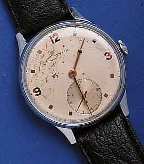 CYMA HECYMA HERRENARMBANDUHR, SCHWEIZ UM 1940, GR. METALLGEH. VERCHR., EDELST.-BODEN U. GLASR. GEDR., AUßER KRONE, GLAS U. BAND ORIG.-ZUST., ...