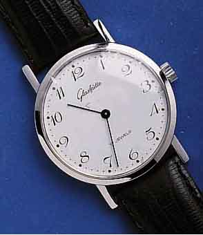 GLASHGLASHÜTTE HERRENARMBANDUHR, DEUTSCHLAND UM 1984, METALL VERCHR., EDELST.-BODEN GEDR., EMAILFARB. KONTRASTZIFFERBL., FORMANKERW., KAL. ...