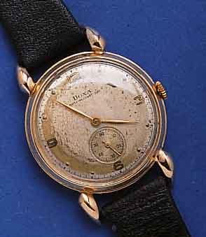 DOXA HERRENARMBANDUHR, SCHWEIZ UM 1941, ROSE-G. 585/000, BODEN GEDR., TROPFENFÖRM. BANDANST., ORIG.-BLATT FL., LEDERB. NEU, RUNDANKERW., 15 ST., ...