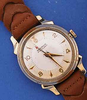 BENRUS/LANGENDORF ARMBANDWECKER, SCHWEIZ/USA UM 1954, METALL M. GG-AUFL., EDELST.BOD. AUF- GEDR., VERS. BLATT M. WECKBEREITSCHAFTSANZ. DURCH ...