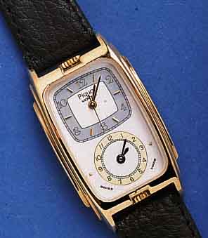 PIQUOT ZWEIZEITZONENUHR MERIDIEN, SCHWEIZ UM 1994, UNGETR., METALL VERG., EDELST.-BODEN GEDR., ZWEI VONEINANDER UNABH. QUARTZW., 1X M. ZENTRALSEK., ...