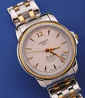 TISSOT HERRENARMBANDUHR BALLADE, AUTOMATIK, BICOLOR, EDELST., TEILW. POL., TEILW. SAT., LÜN., KRONE M. SEITENSCHUTZ, SOWIE ZWISCHENGL. D. EDELST. ...