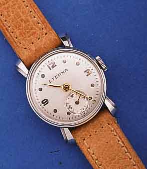 ETERNA DAMENARMBANDUHR, UNGETRAGEN, LAGER- WARE, UM 1940, EDELST., BOD. U. GLASRAND AUF- GEDR., GESPREIZTE U. GESTUFTE WANDANSTÖßE, 2- FARBIG ...