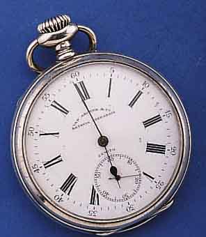 ZENITH OFFENE HERRENTASCHENUHR FÜR VAN ARCKEN& CO., KÖNIGL. HOFUHRMACHER DER NL, SO GRAV. U. SIGN. AUF CUV. U. EMAILZIFFERBL.(BL. FEIN- ...
