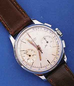 LEONIDAS ARMBANDCHRONOGRAPH, SCHWEIZ UM 1964, METALL HARTVERCHR., EDELST.-BODEN U. GLASR. GEDR., BLATT VERS., TACHYMETERAUßENSK., ...