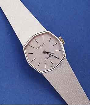 TISSOT DAMENGOLDBANDUHR, SCHWEIZ UM 1972, UNGETR. LAGERW., WG 750/000-GEH. INCL. WG- MILANAISEBAND, SAPHIRFLACHGL., BODEN GEDR., EHEM. UNVERB. ...