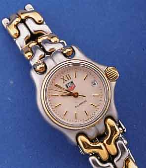 HEUER/TAG DAMENARMBANDUHR, SCHWEIZ UM 1995, EDELST. MATT. INCL. EDELST.-BAND, ZWISCHENGL. WIE SCHR.-KRONE U. LÜNETTE HARTVERG., SICHER- ...