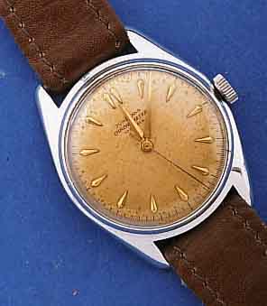 JUNGHANS HERRENARMBANDUHR, CHRONOMETER, DEUTSCHLAND UM 1960, METALLGEH. NACHVERCHR., EDELST.BOD. GESCHR., ORIG. BL. FARBL. ALTERS- BED. GET., 17 ...
