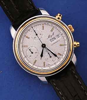 M & M ARMBANDCHRONOGRAPH AUTOMATIK, SCHWEIZ UM 1996, EDELST. POL., BEIDS. MINERALFLACH- VERGL., DRÜCKER, KRONE SOWIE LÜNETTE HART- VERG., BLATT ...