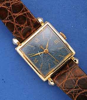 LACO HERRENARMBANDUHR, DEUTSCHLAND UM 1955, ROSE-G 585/000-GEH., BET. BANDANST., BOD. M. SCHARNIER VORGESEHEN, BL. ZUM RAND ZU FLECKIG, ...