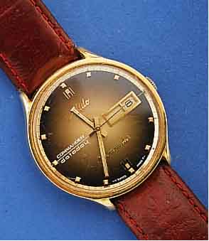 MIDO HERRENARMBANDUHR DATO DAY KOMMANDER/ CHRONOMETER, SCHWEIZ UM 1968, METALL-EIN- SCHALENGEH., GG-AUFLAGE, BER., ZENTRALROTOR KUGELGELAGERT UND ...