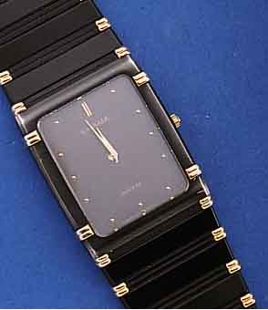 LASSALE ARMBANDUHR, JAPAN UM 1985, EDELST. SCHWARZ MATT., ZWISCHENGLIEDER SOWIE TEILE DER L?N. HART VERG., MINERALFLACHGL., BOD. AUFGE- DR., ...